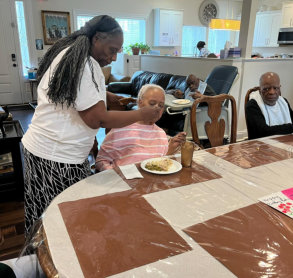 woman feeding the elderly