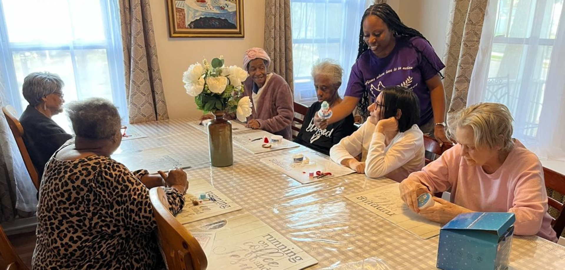 woman talking to the senior in the table