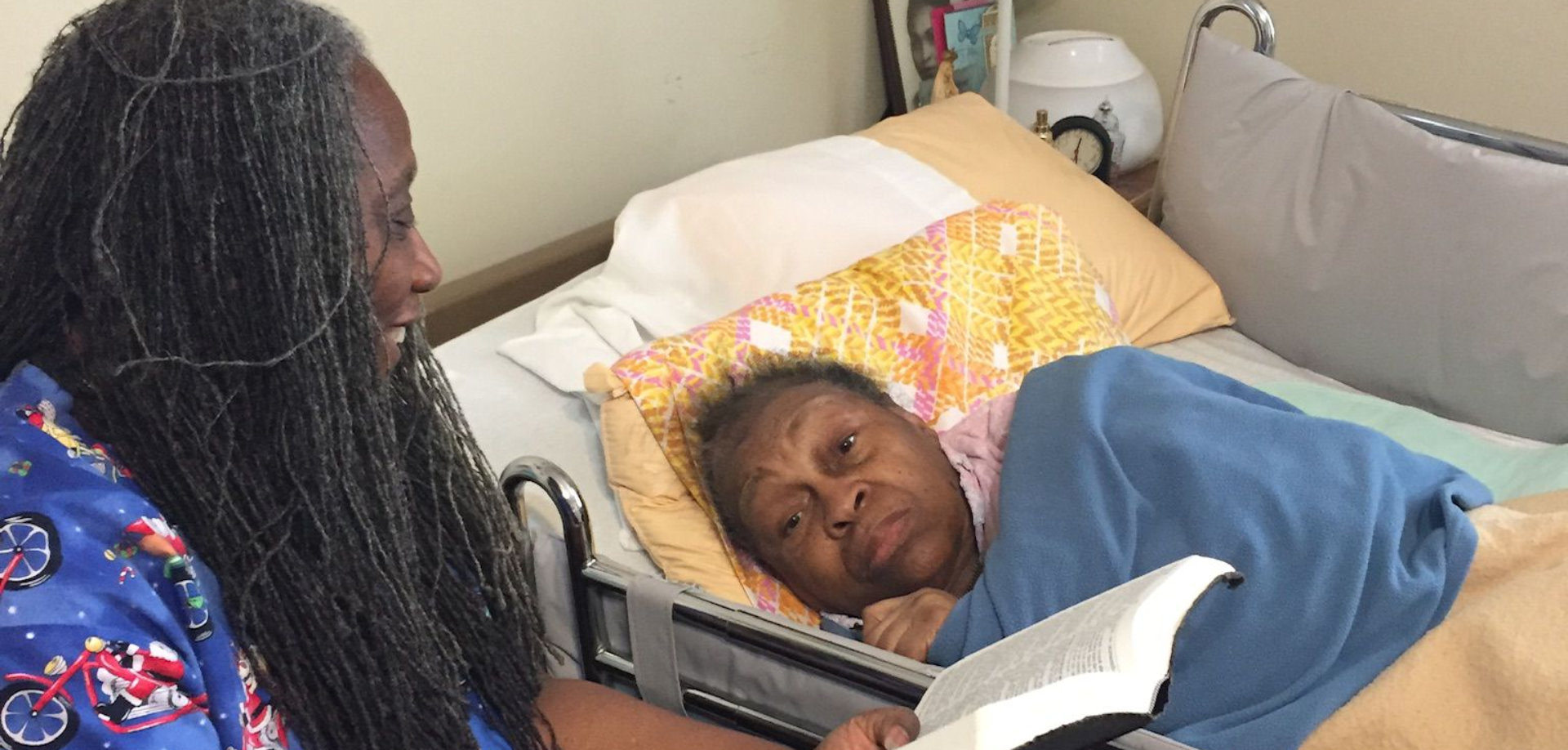 nurse reading book to patient