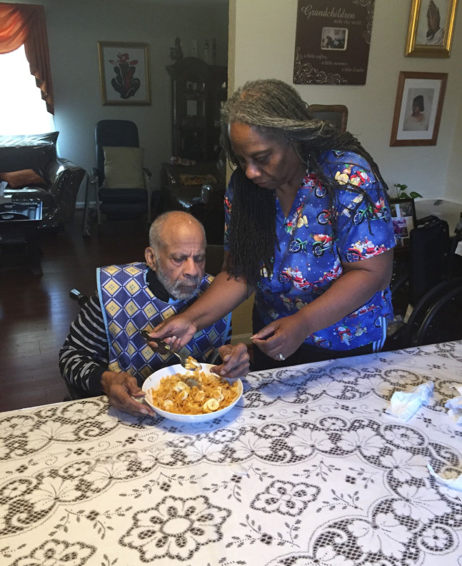 nurse helping an elderly eat